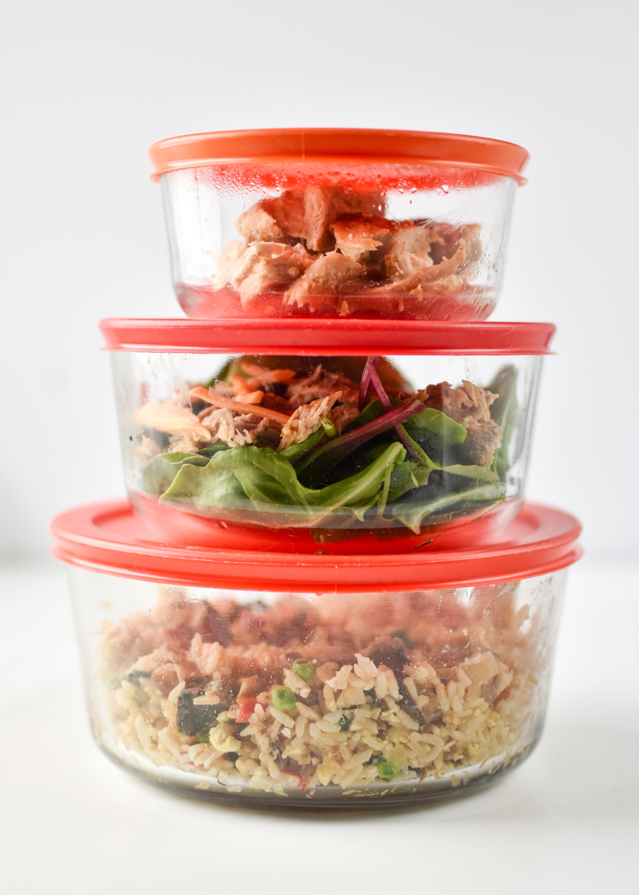 Three glass Pyrex containers with leftovers from my fridge - 7 cup, 4 cup, and 2 cup size.